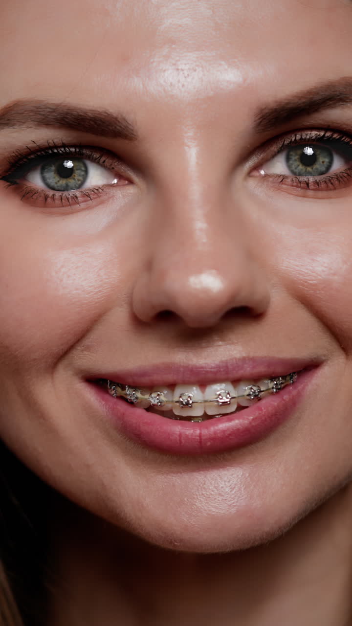 Woman with braces smiling