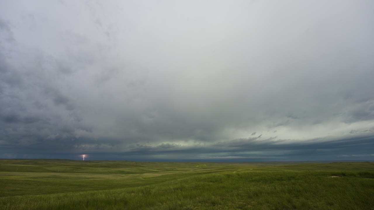 Skies Darken As Storm Clouds Move In Over Rolling Green Hills