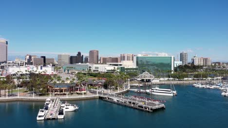 lion lighthouse in the port of long beach with a scan of the queen mary passenger liner ship