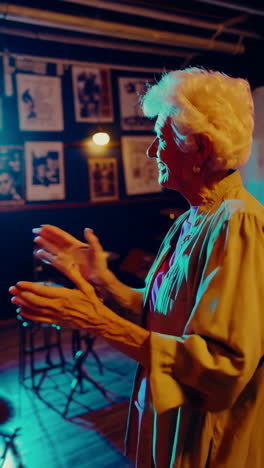 elderly woman enjoying a concert