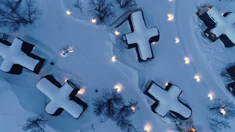 aerial overhead shot of a winter landscape with holiday homes in cross shape