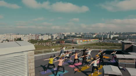 group yoga class on a rooftop