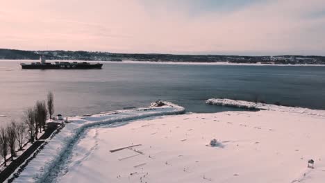 Cargo-ship-travelling-in-the-winter-cold-ice-ocean