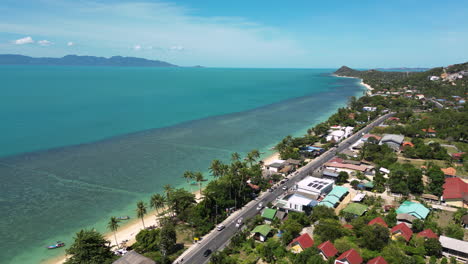 Aerial-View-of-Mae-Nam-Coastline-in-Koh-Samui-with-Tropical-Homes-and-Beach