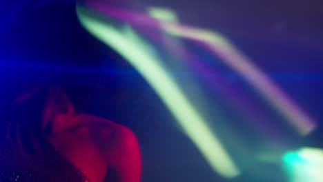 Close-Up-Of-Young-Woman-In-Nightclub-Bar-Or-Disco-Dancing-With-Sparkling-Lights-6