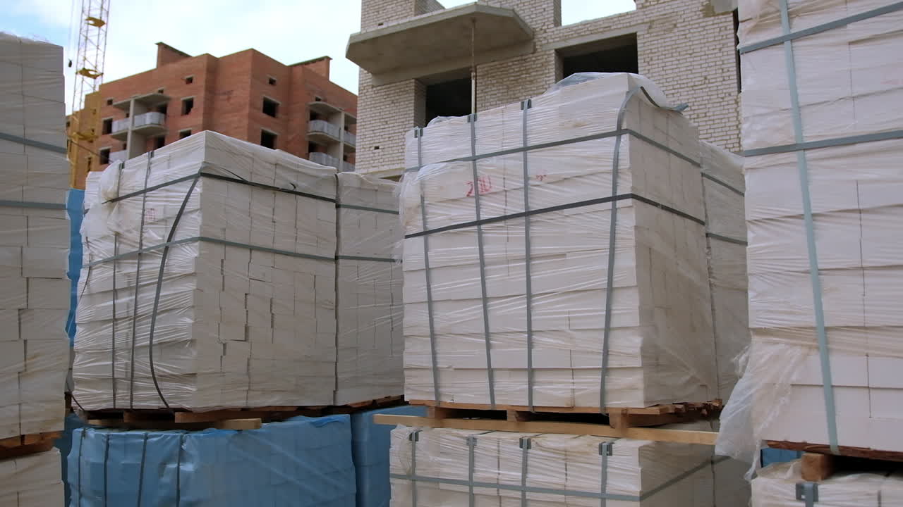 Stacked Bricks on Pallets at a Construction Site