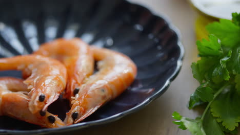 freshly cooked shrimps served on plate