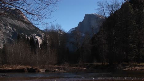 A-Stream-Rushes-By-With-Scenic-Mountains-In-The-Background