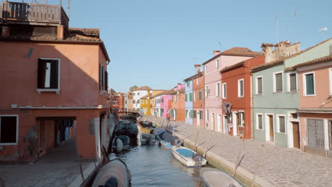 brightly coloured houses alongside the canal in burano italy