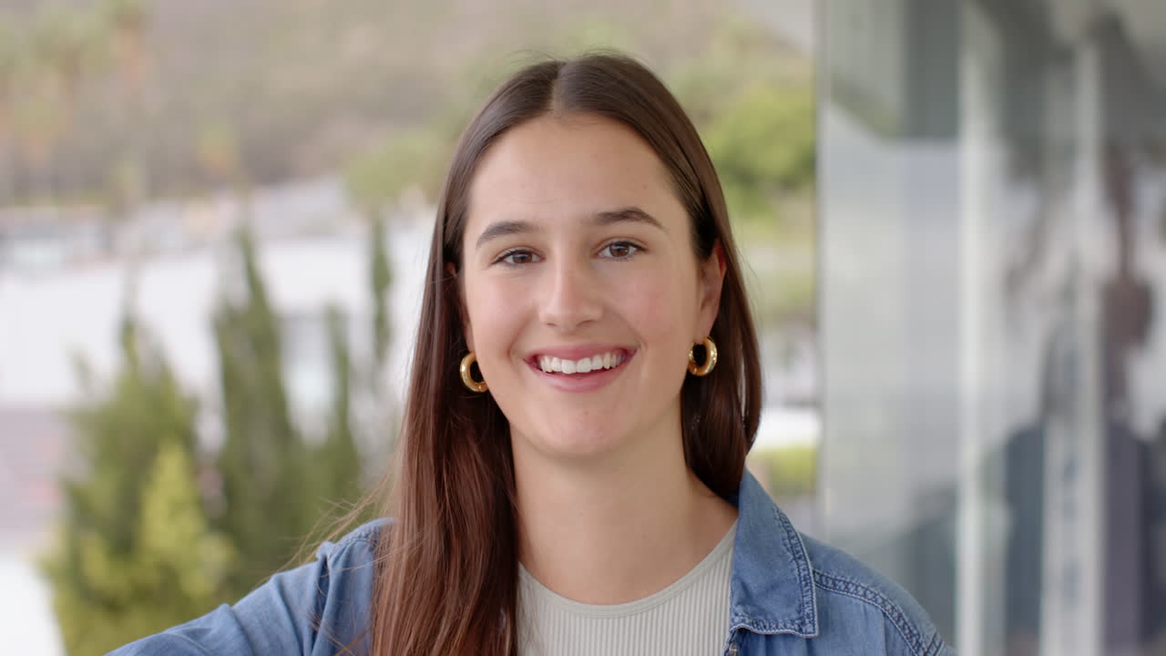 Smiling woman in casual outfit, standing outdoors, enjoying fresh air, at home