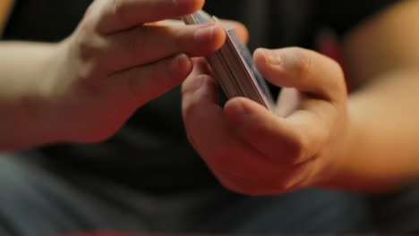 Slow-motion-closeup-of-hands-shuffling-a-deck-of-cards