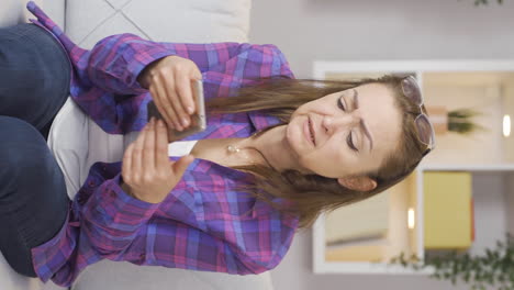 Vertical-video-of-The-unsuccessful-woman-is-frustrated.