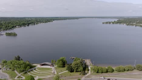 lake cadillac in cadillac, michigan with drone video moving in wide shot