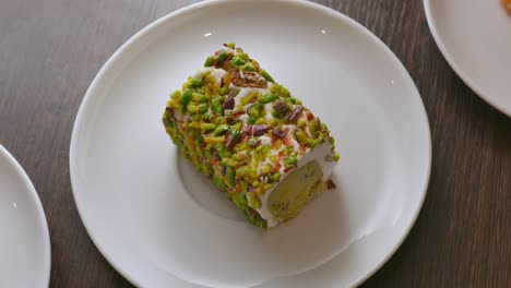 sweet pistachio dessert on a white plate