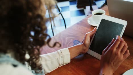 woman using digital tablet