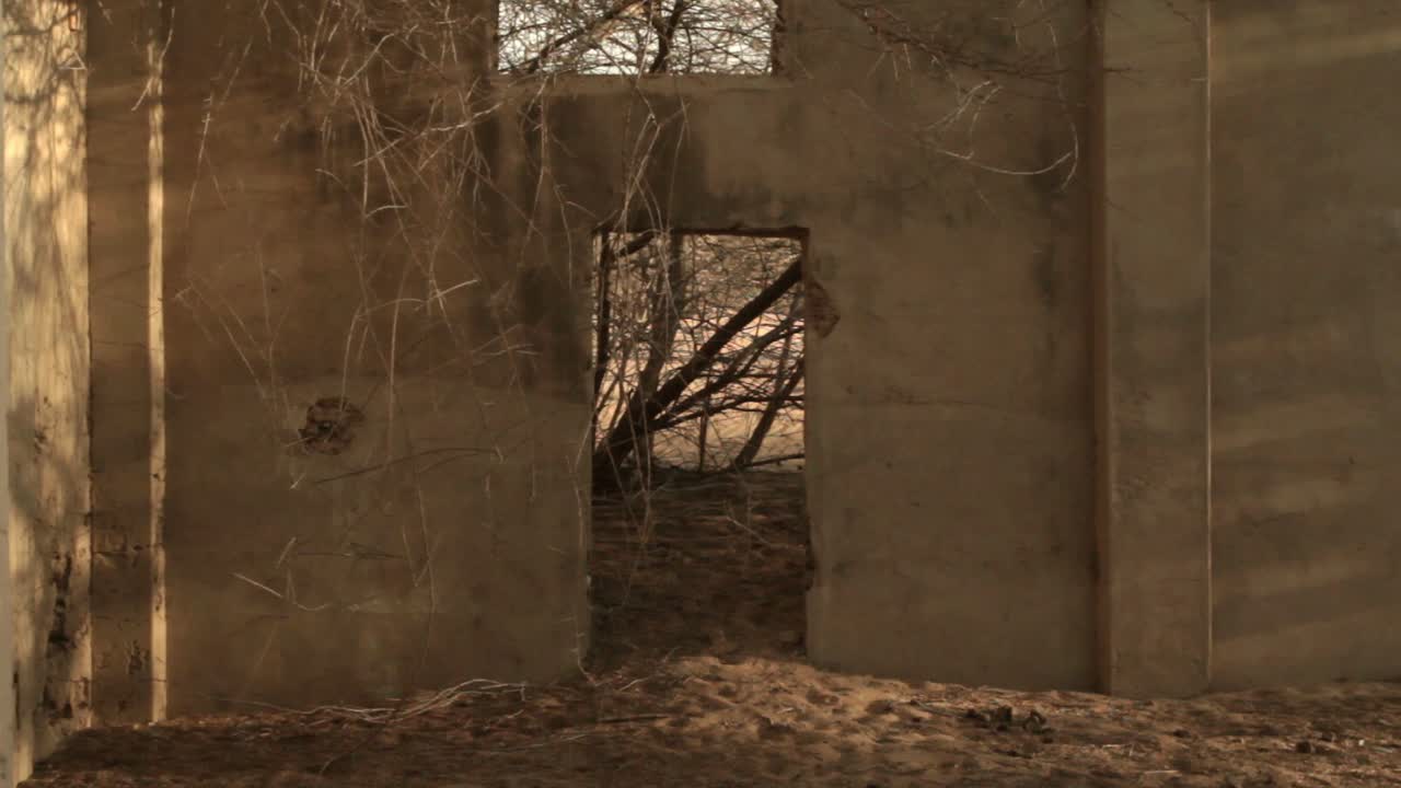 Medium shot of house ruins in the ghost town of Puerto , in northern Guajira, Colombia