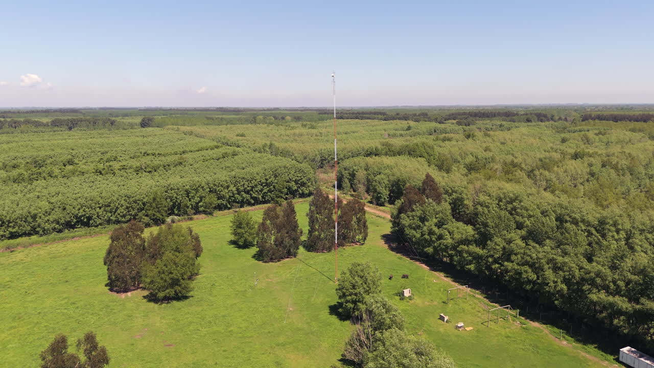 Telecommunications tower, cell phones, and radio transmitters in rural area