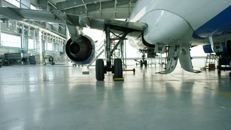 airplane under maintenance in hangar