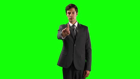 Front-view-of-a-Caucasian-man-touching-the-screen-with-green-screen