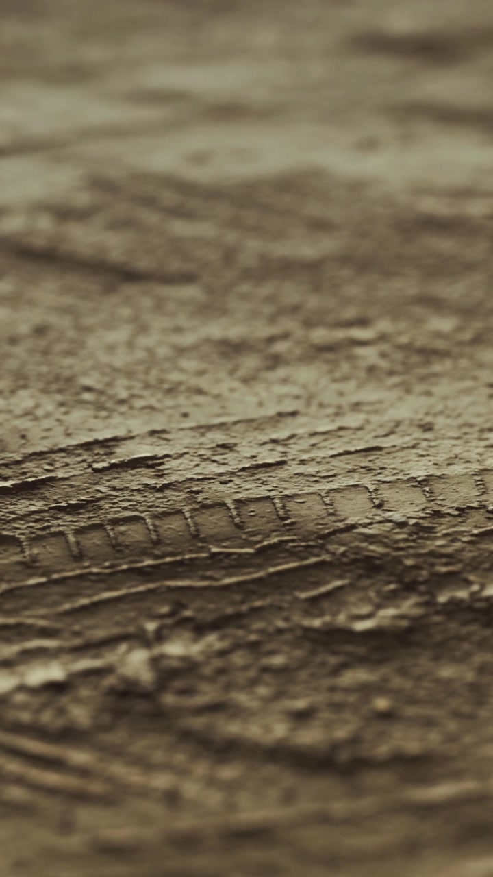 Close view of cracked earth surface during dry season in natural setting