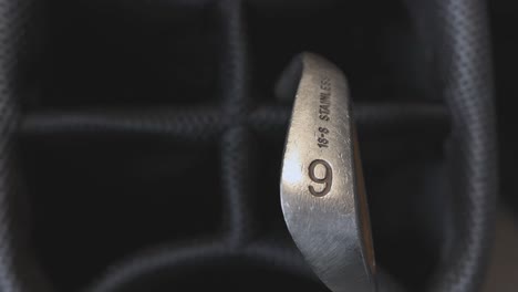 close-up of a black golf club organizer