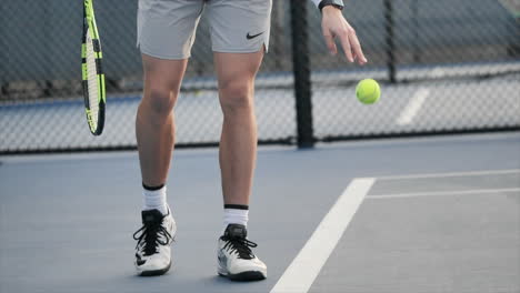 Tennis-player-bouncing-a-tennis-ball-in-slow-mo