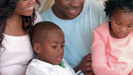 happy family shopping online with laptop