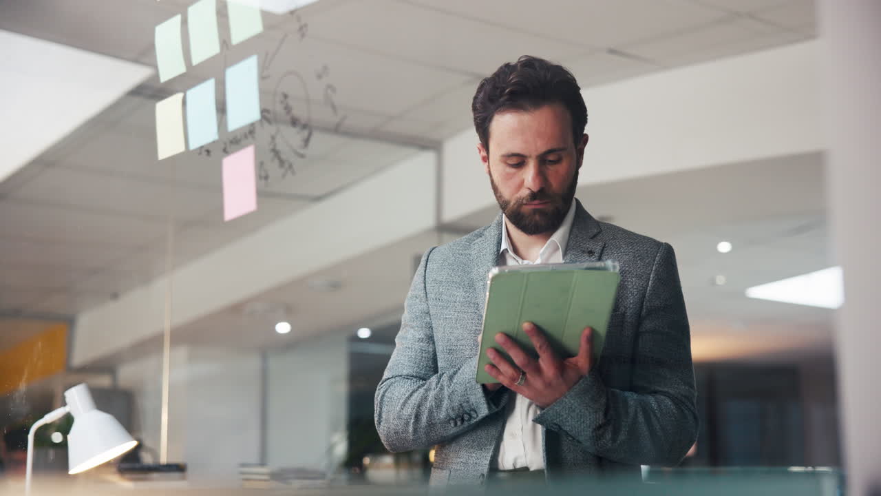 Businessman working on tablet in office