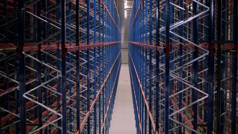 big and modern warehouse under construction, featuring metal shelving and other industrial equipment.