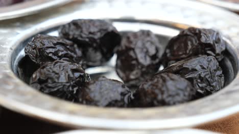 black olives in a silver bowl