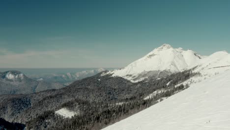 snowy winter slopes in russia mountain ski resort - aerial establisher