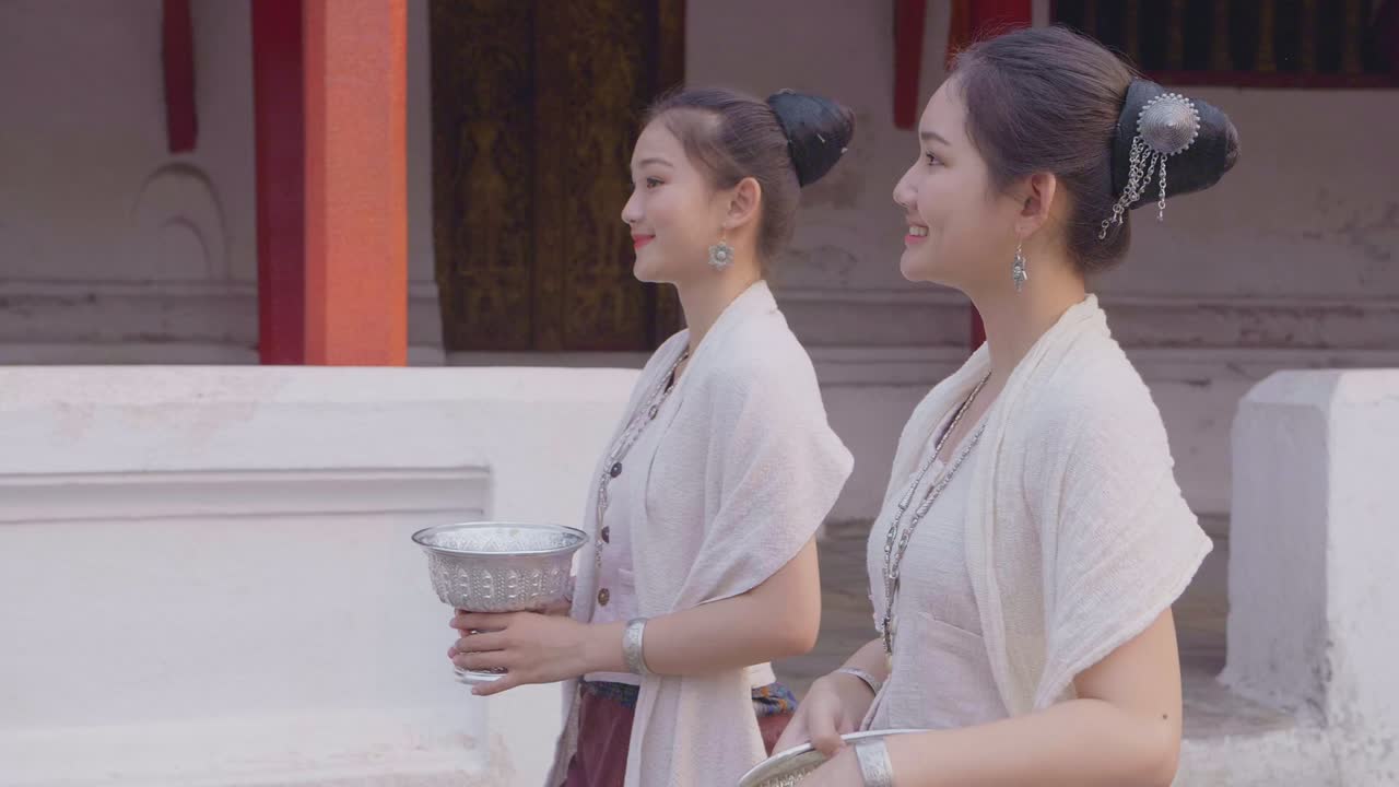 Girls In Thai Traditional Dress Walking With The Water Bowl , Slow Motion