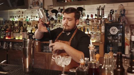 bartender making cocktails at a bar