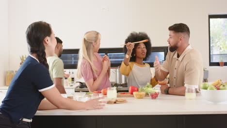 preparing food together, group of young friends enjoying time in kitchen