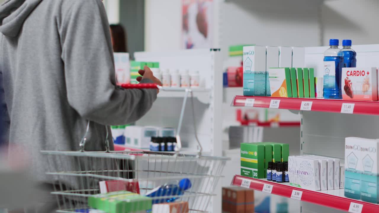 Customer shopping for vitamins and supplements in a pharmacy