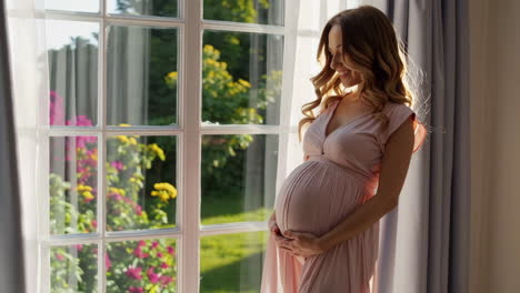 pregnant woman by the window