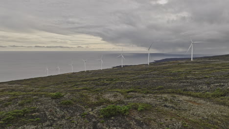 Maui-Hawaii-Aerial-v8-flyover-Auwahi-wind-farm-with-eight-turbines-on-Ulupalakua-Ranch-along-southeastern-coastline-of-the-island,-generating-renewable-energy---Shot-with-Mavic-3-Cine---December-2022