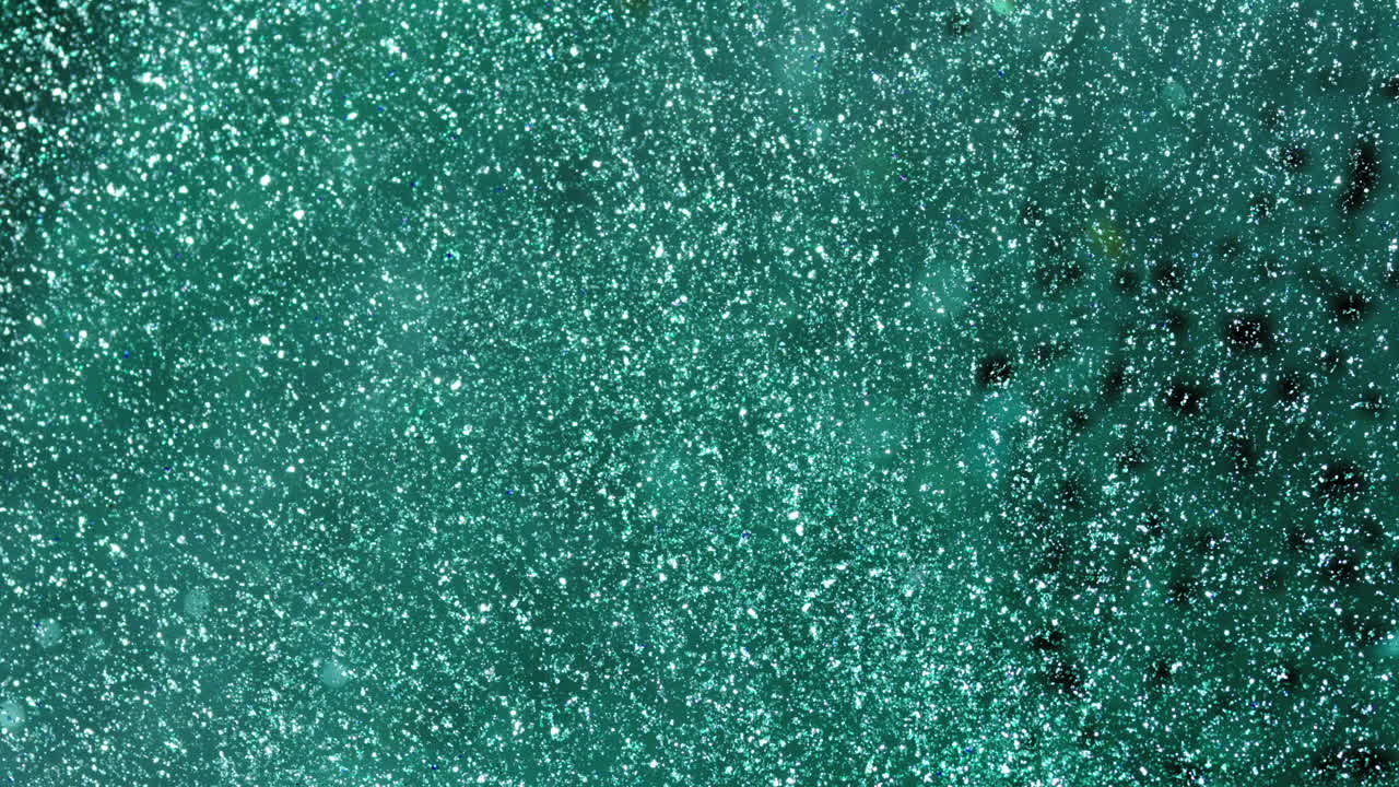 Macro shot of mixing green inks, creating a vibrant, artistic pattern
