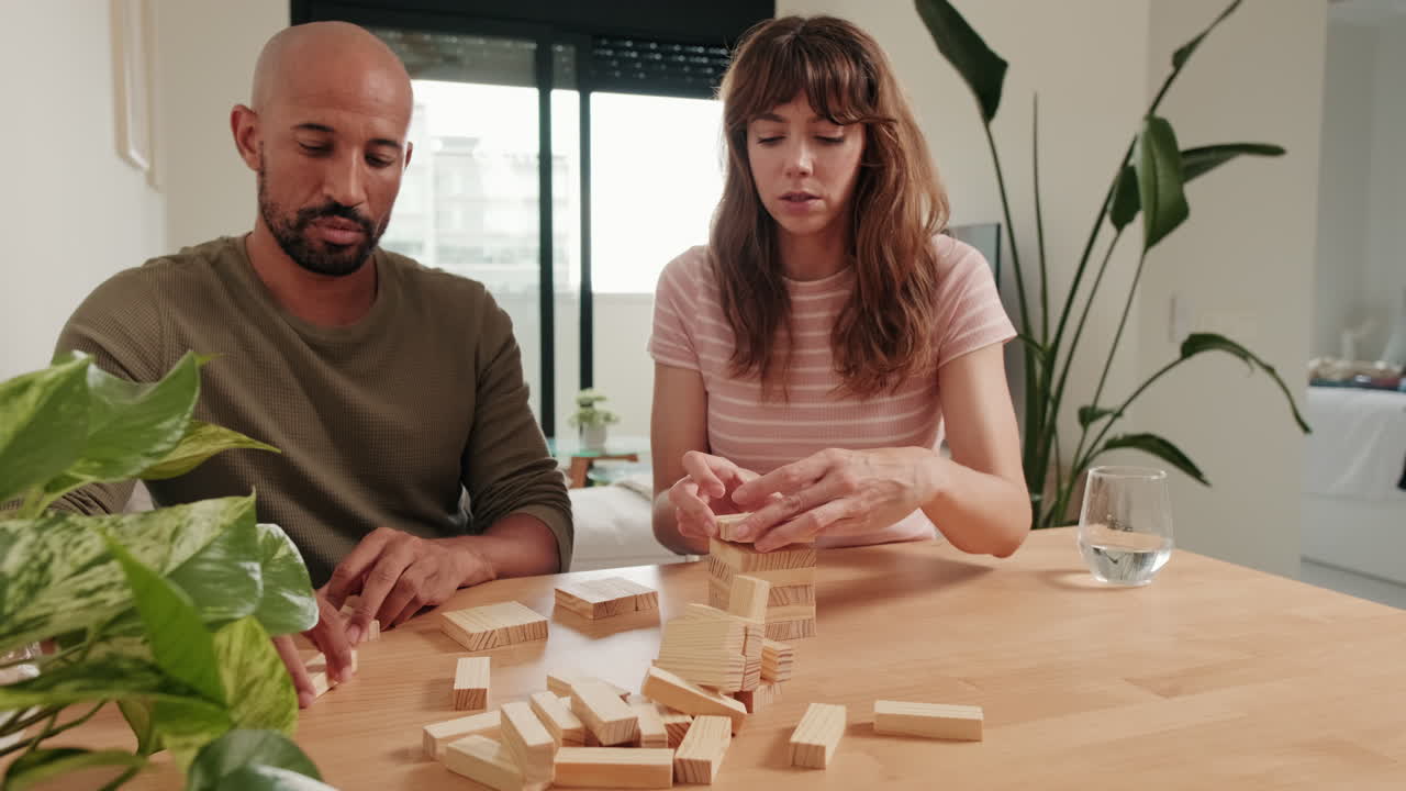 Couple Playing Jenga at Home