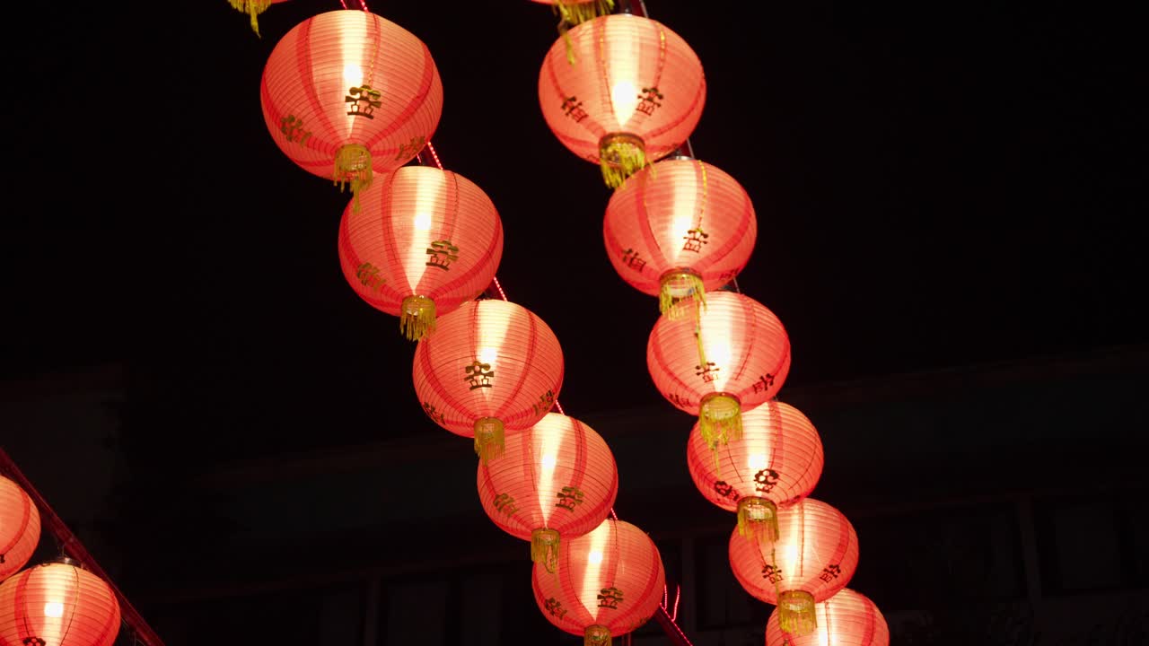 Decorative Chinese Lamps Shining In The Streets At Night. Low Angle Shot
