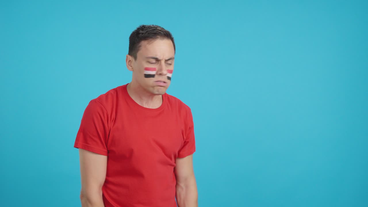 Man cheering for Egypt, angry with the decision of referee