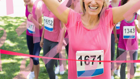 Animation-of-multiple-pink-ribbon-logo-over-diverse-group-of-smiling-women