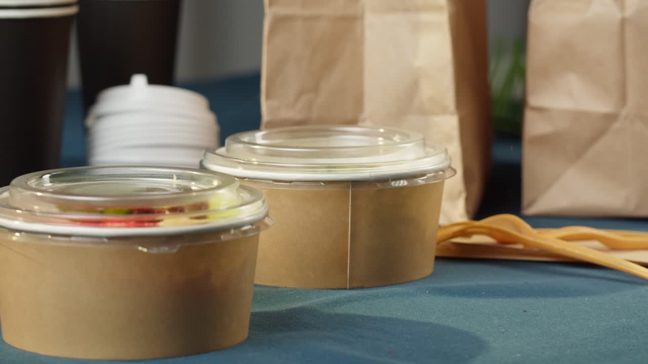 Gloved Hand Packing Healthy Poke Bowl for Takeaway Delivery