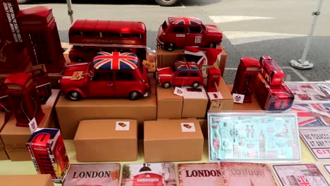 london red souvenirs in portobello market in street stall of notting hill neighbourhood, london