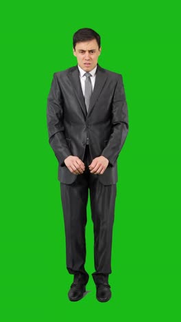 uncomfortable businessman on green screen