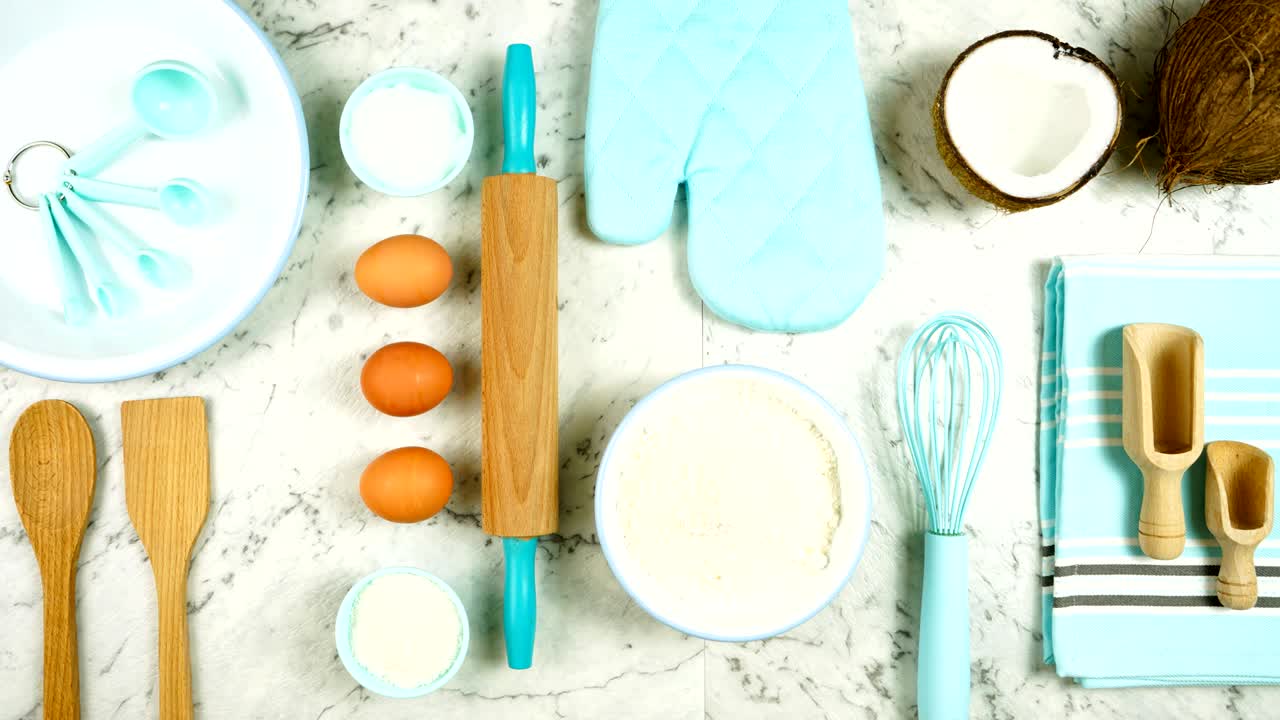 Coconut baking theme flat lay creative layout overhead on marble table top.