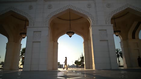 girl walking in mosque outside