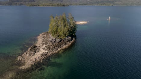small island by the coast of vancouver island (british columbia - canada). drone footage.