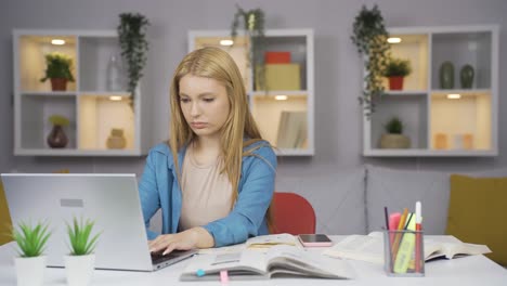 the female student who finishes the homework is happy and peaceful.