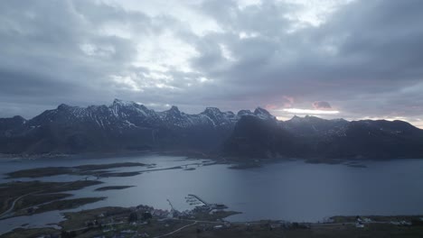 Aerial-view-overlooking-the-Fredvang-town-and-bridges,-dramatic-evening-in-Lofoten,-Norway